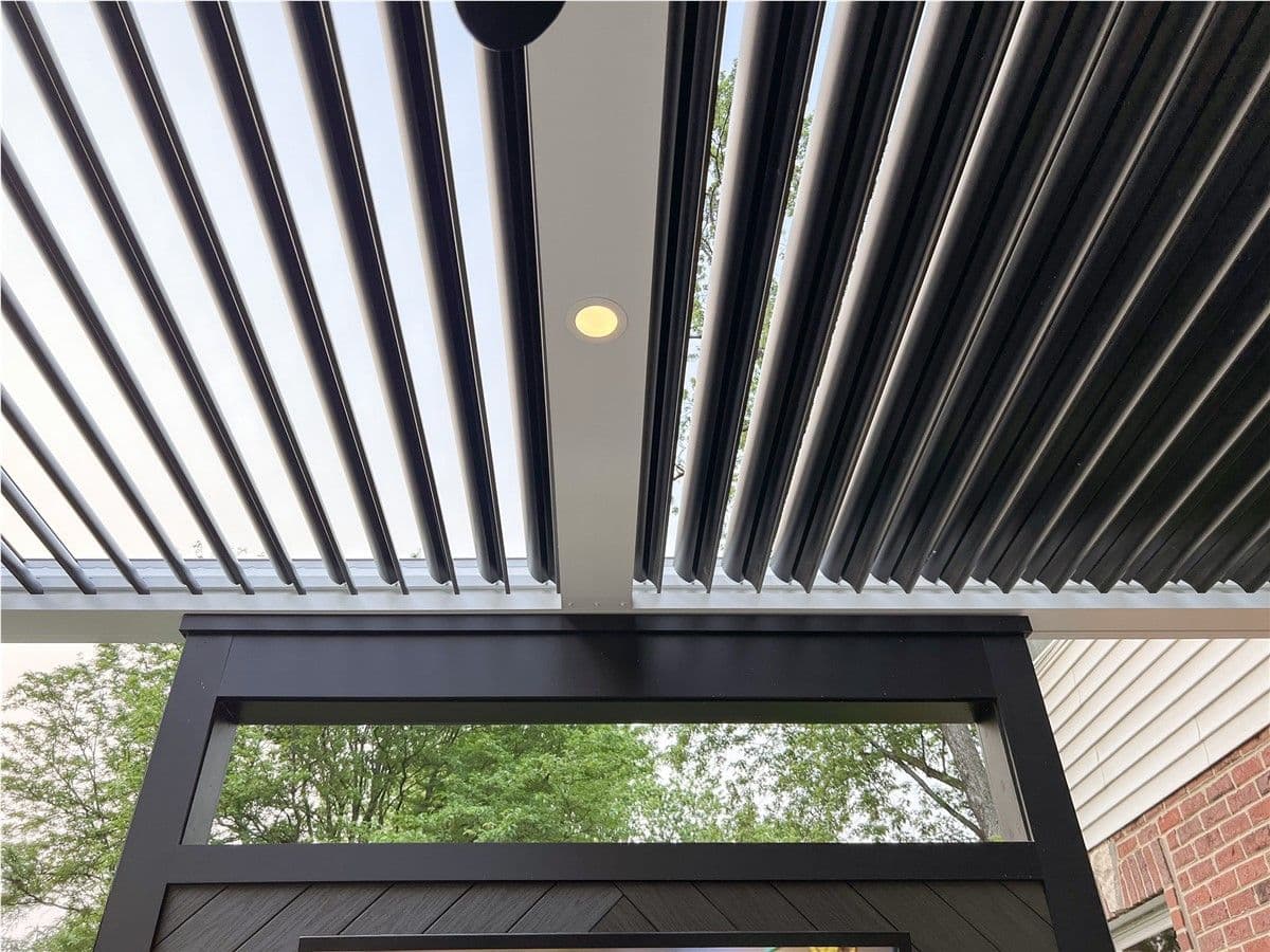 Details of the pergola's louvered roof and built-in recessed lighting.