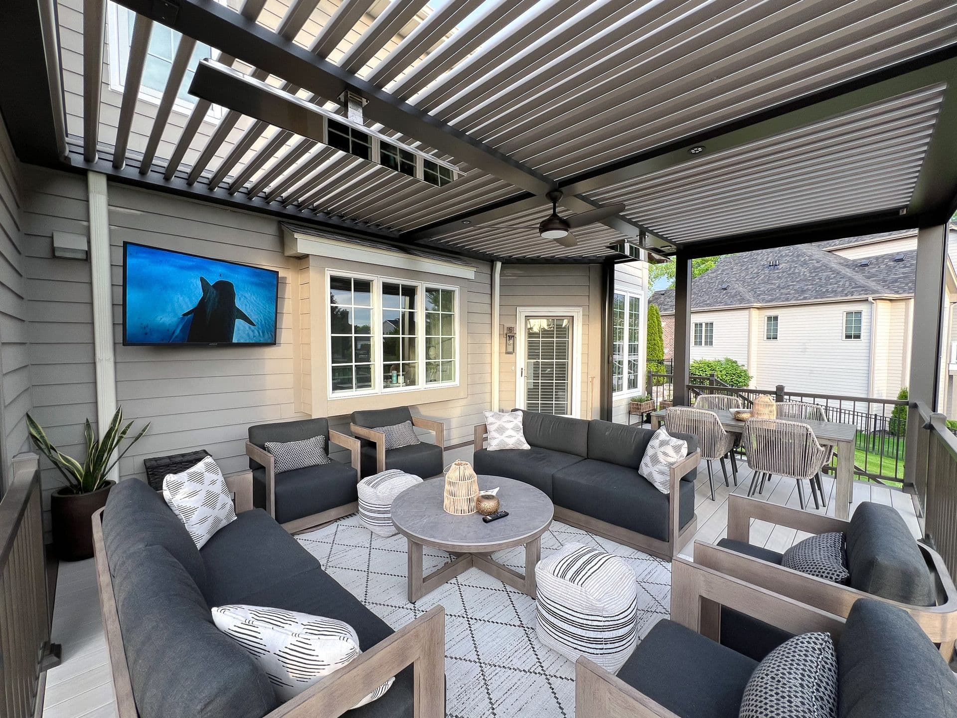 Deck with pergola overhead of outdoor living space.